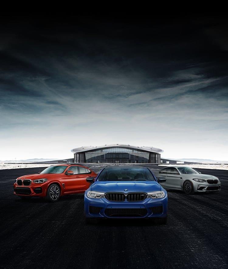 A Pack Shot Of Bmw M Vehicles Parked Outside A Modern - Bmw Z4 - HD Wallpaper 