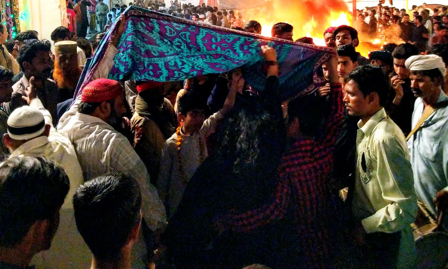 A Female Devotee Performing Dhamaal Next To The Fire - Crowd - HD Wallpaper 