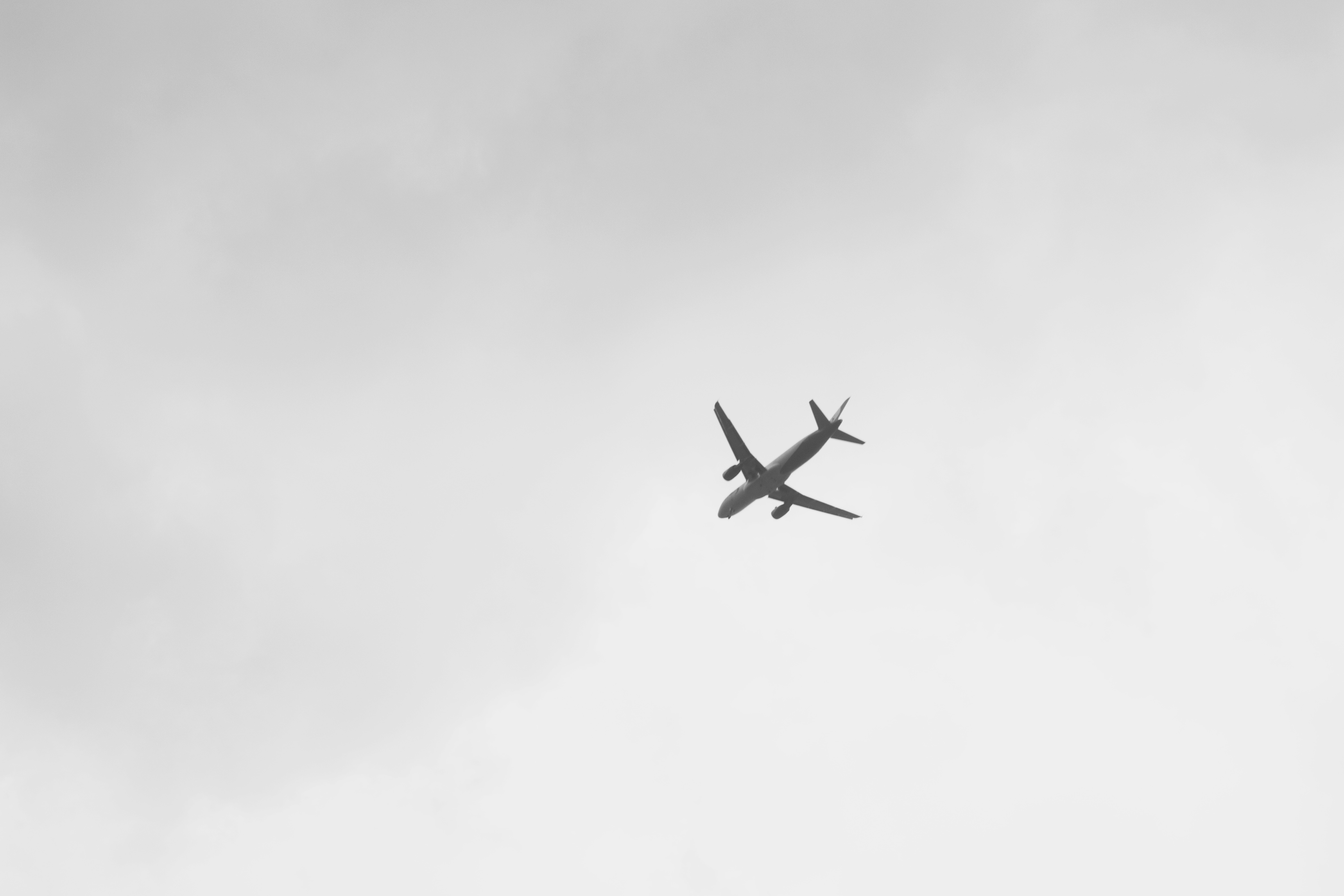 Plane In White Sky - 4752x3168 Wallpaper 