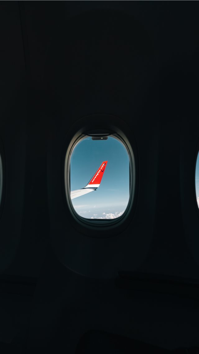 Red Airplane Wing Through Window Iphone Wallpaper - Airliner - HD Wallpaper 
