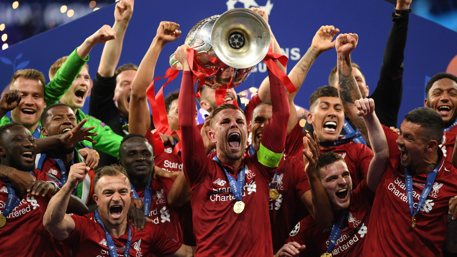 jordan henderson lifting champions league trophy