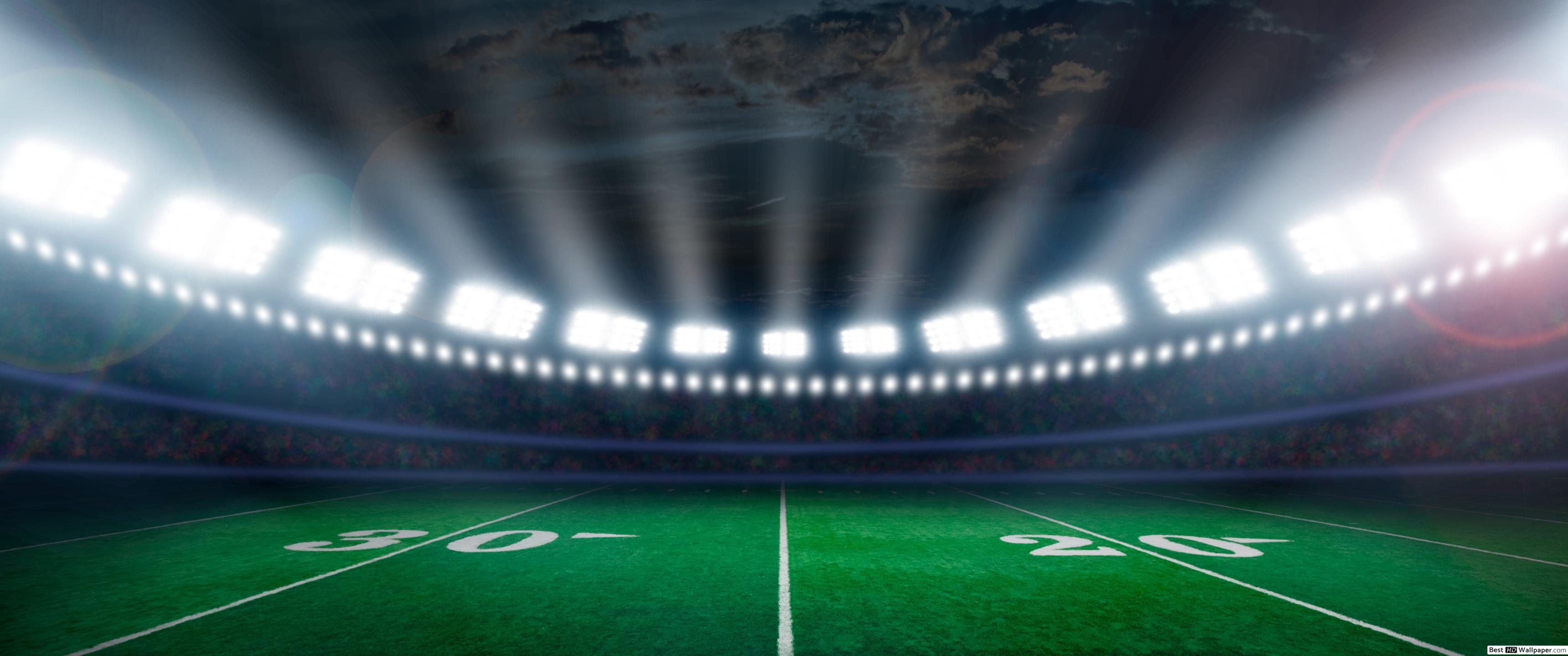 Football Field Illuminated By Stadium Lights - HD Wallpaper 