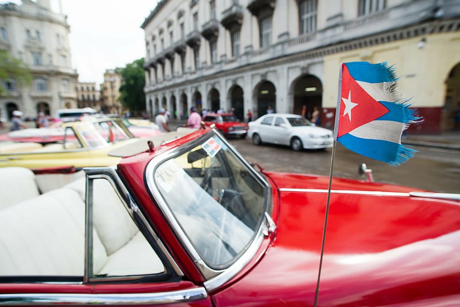 Red Convertible Car With Flag On The Street, Cuba, - Casa Particular Havana Luxury - HD Wallpaper 