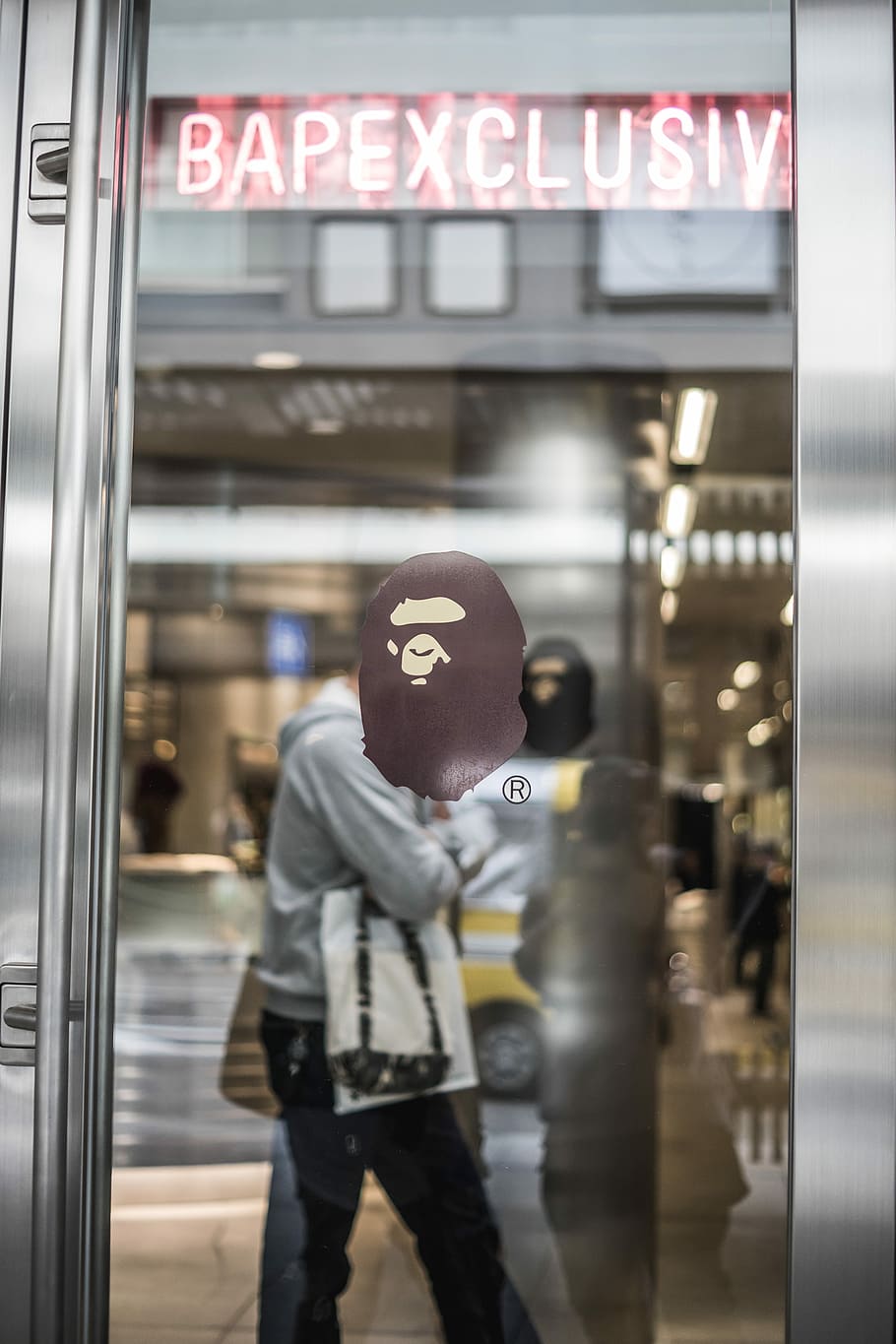 A Bathing Ape Decal On Glass, Man Standing Near Clear - Bathing Ape - HD Wallpaper 
