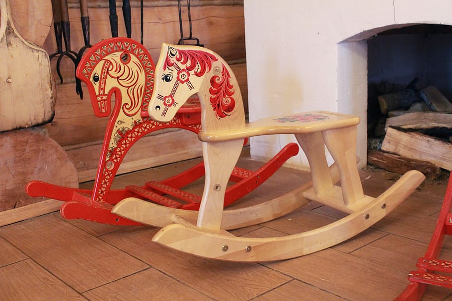 Two Red And Tan Rocking Horses Beside Fireplace, Horse-rocking - HD Wallpaper 
