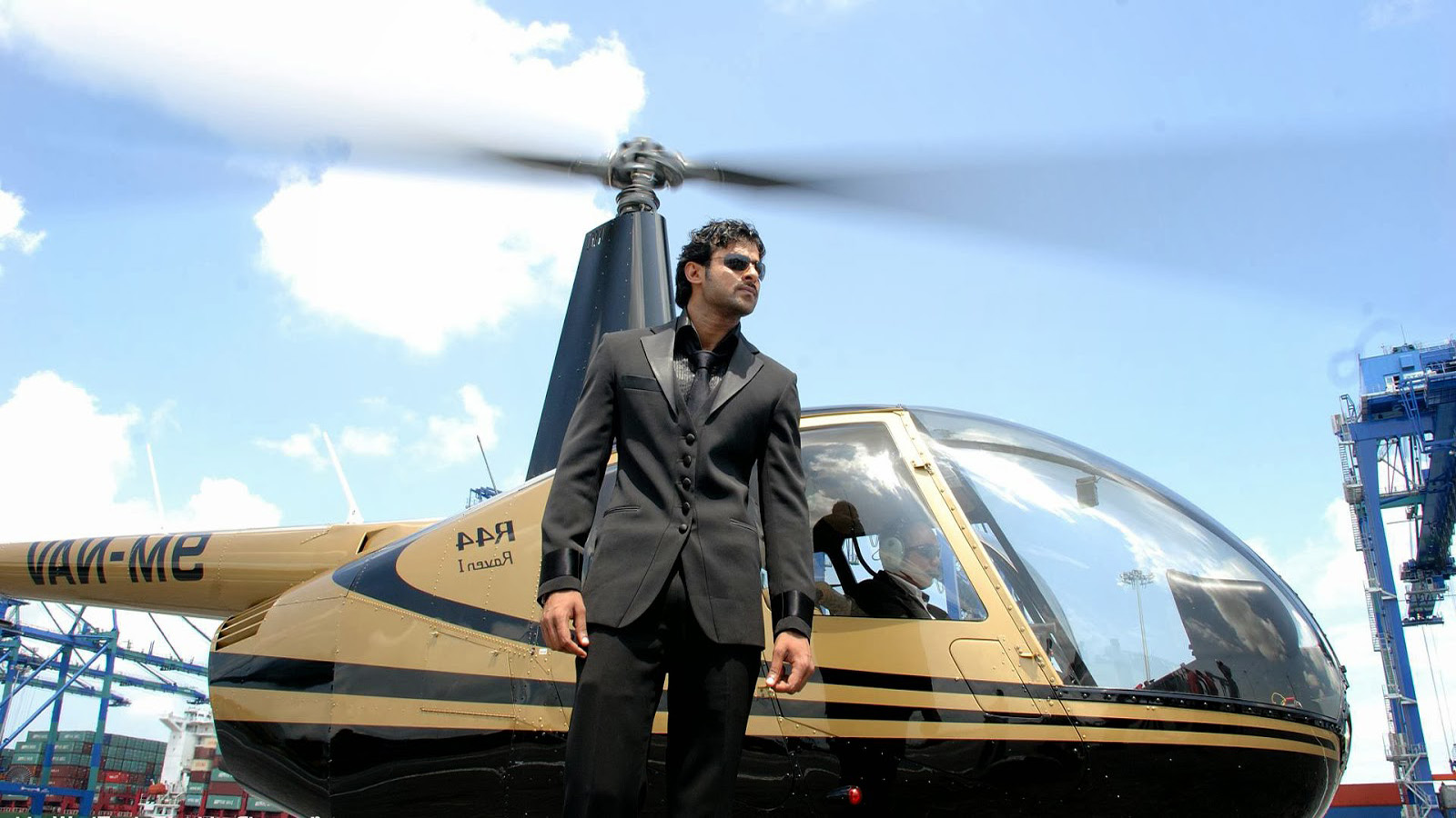 Famous South Actor Prabhas In Black Suit High Definition - Prabhas Helicopter - HD Wallpaper 