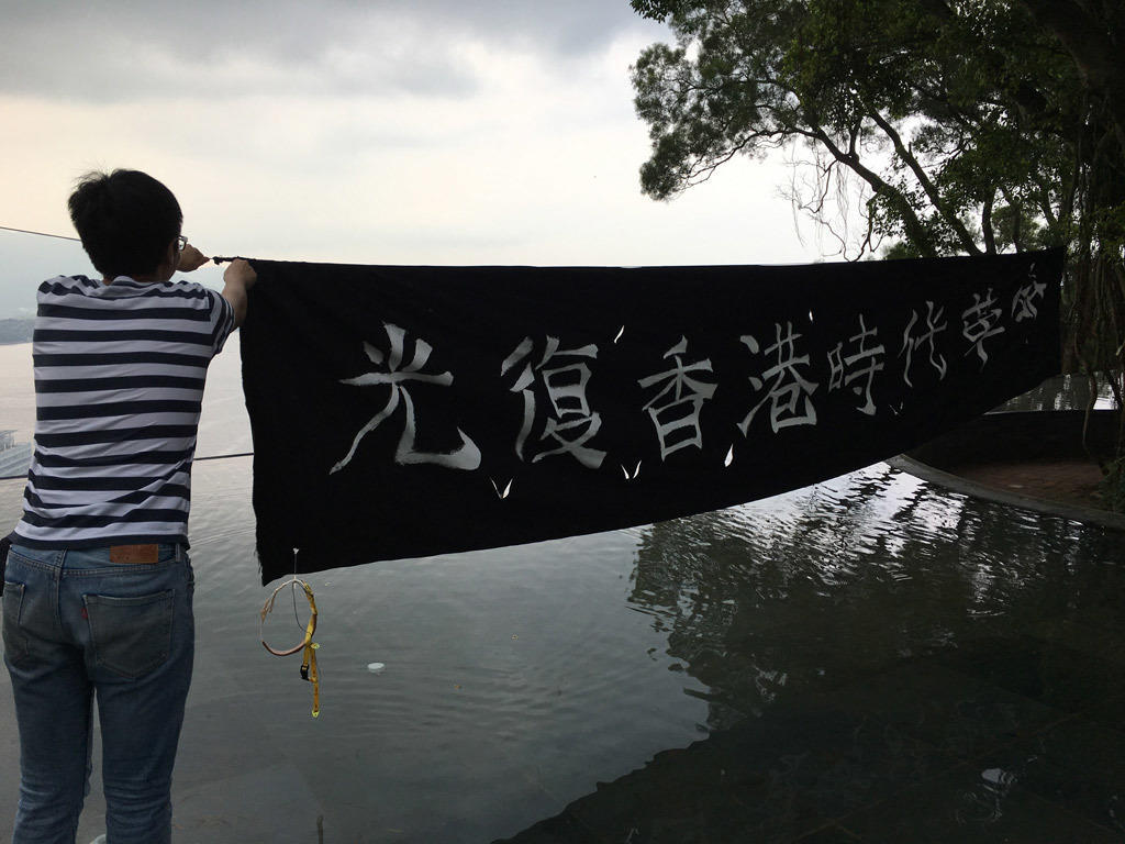 Mike Next To A Banner Carrying His Favourite Slogan - Slogan - HD Wallpaper 