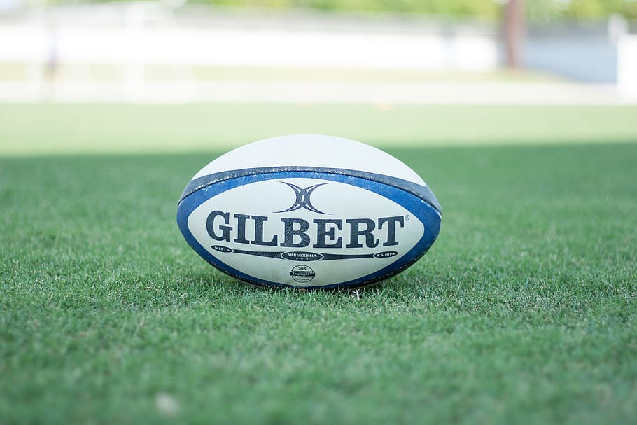 Selective Focus Photography Gilbert Pigskin Ball On - Gilbert Rugby Ball - HD Wallpaper 