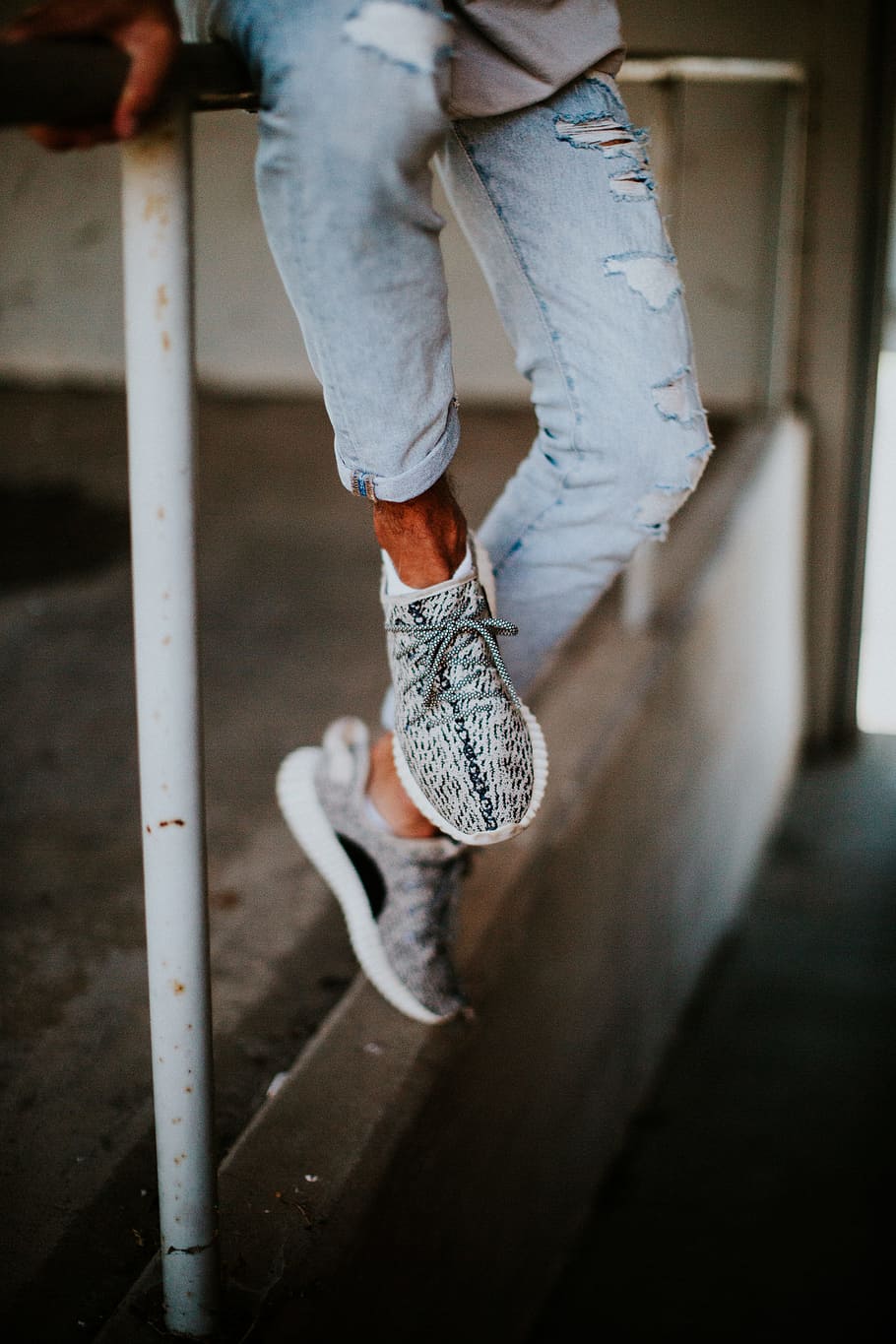 Person Wearing Blue Distressed Jeans And Pair Of Zebra - Wearing Yeezy 350 Zebra - HD Wallpaper 