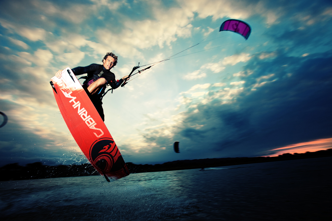 Damien Leroy With A Tailgrab At Dusk On His Cabrinha - Cabrinha Kiteboarding - HD Wallpaper 