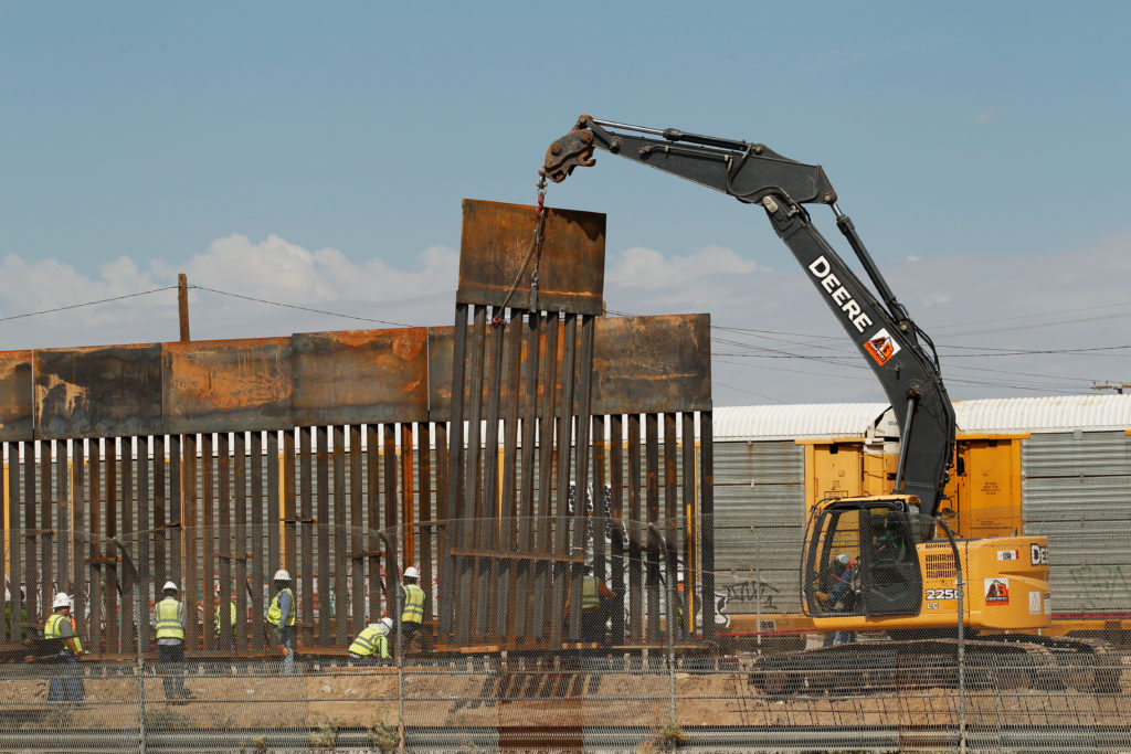 Workers Are Seen Next To Heavy Machinery While Working - Beto Tear Down The Wall - HD Wallpaper 