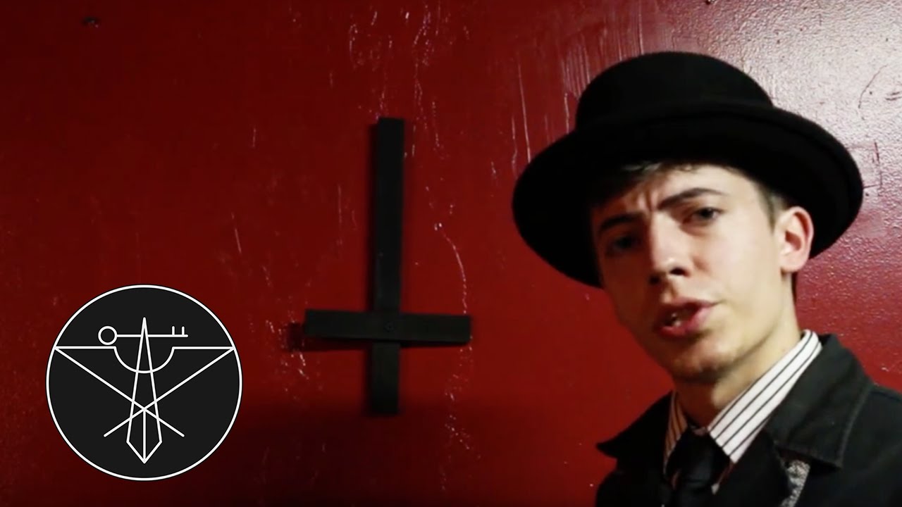 Guy Holding Upside Down Cross - HD Wallpaper 