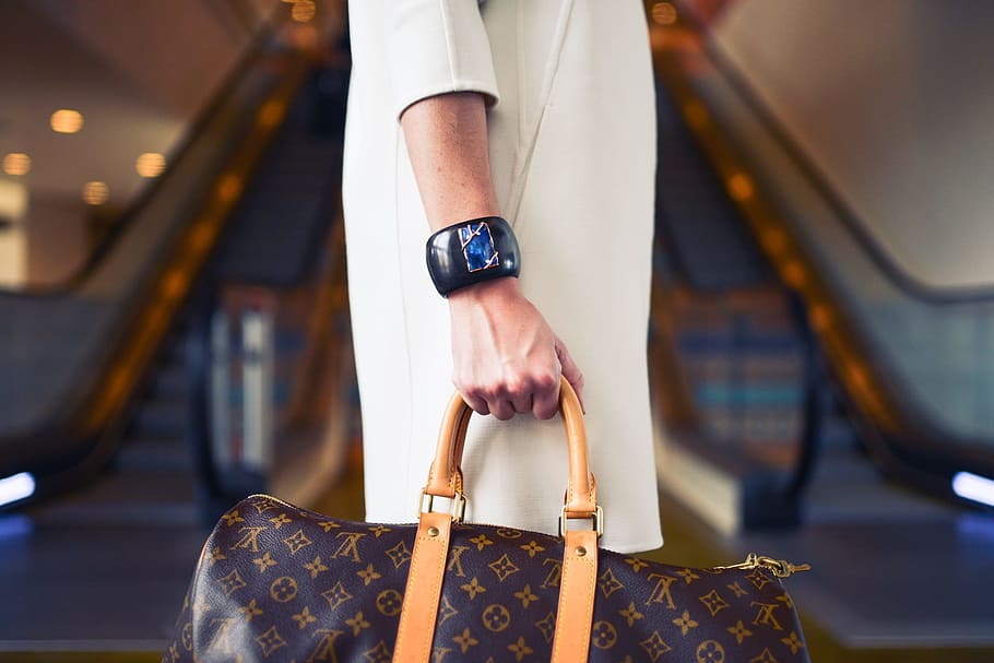 Selective Focus Photo Of Person Holds Louis Vuitton - HD Wallpaper 