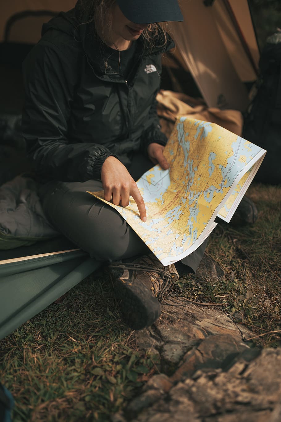 Person Wearing The North Face Jacket Sitting On Sofa - HD Wallpaper 