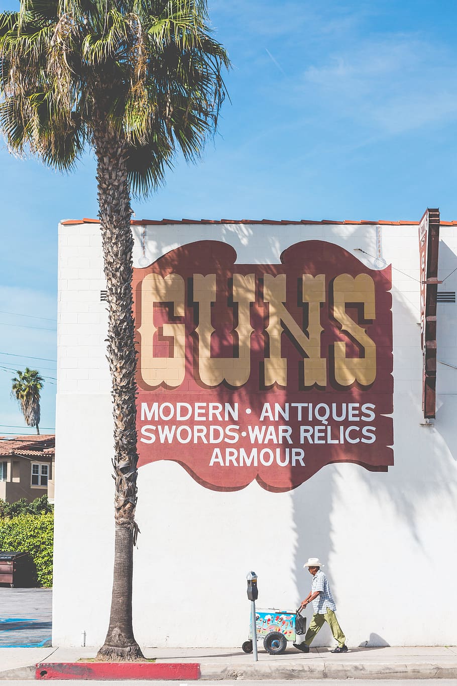 Guns & Icecream, Man Walking In Front Of Guns Shop, - Advertising - HD Wallpaper 