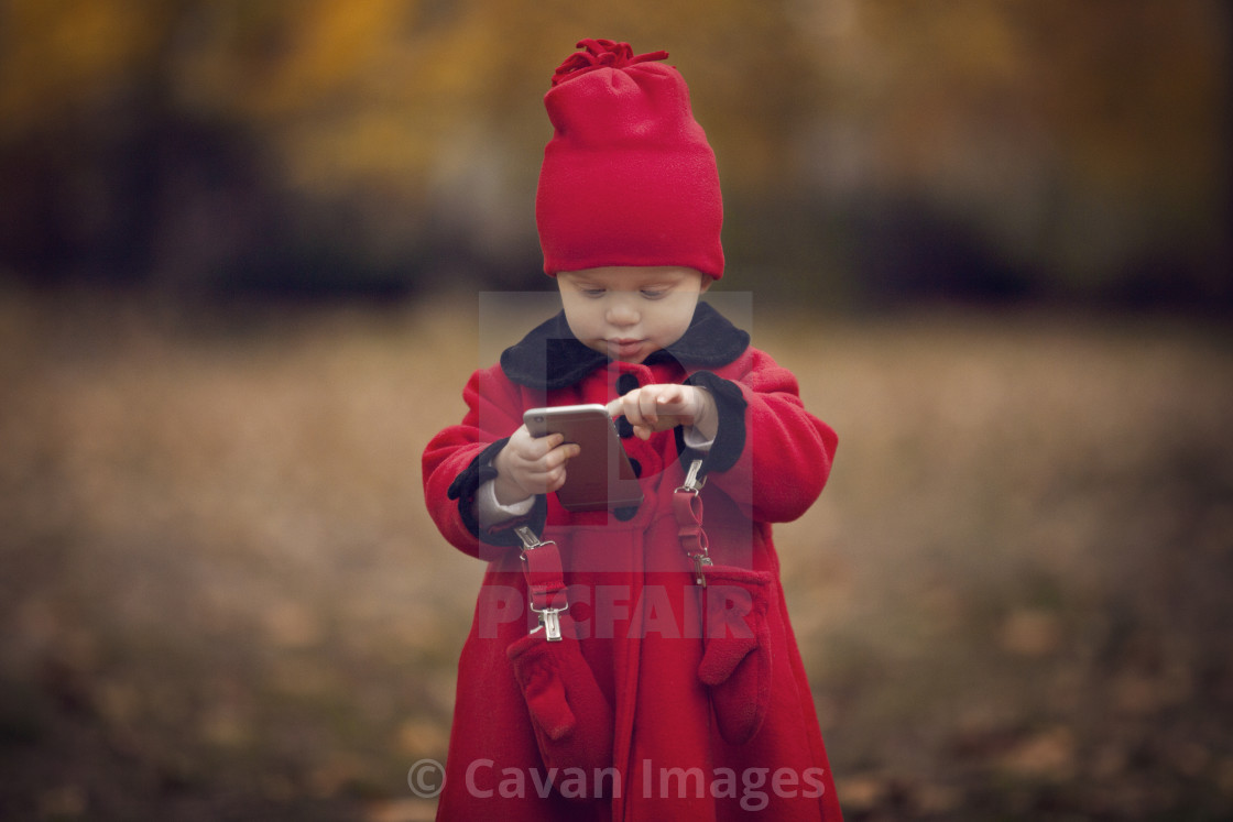Cute Baby Girl Using Smart Phone While Standing On - Smart Cute Baby - HD Wallpaper 