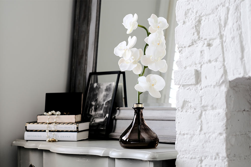 The Orchid On Dressing Table - Artificial Flower - HD Wallpaper 