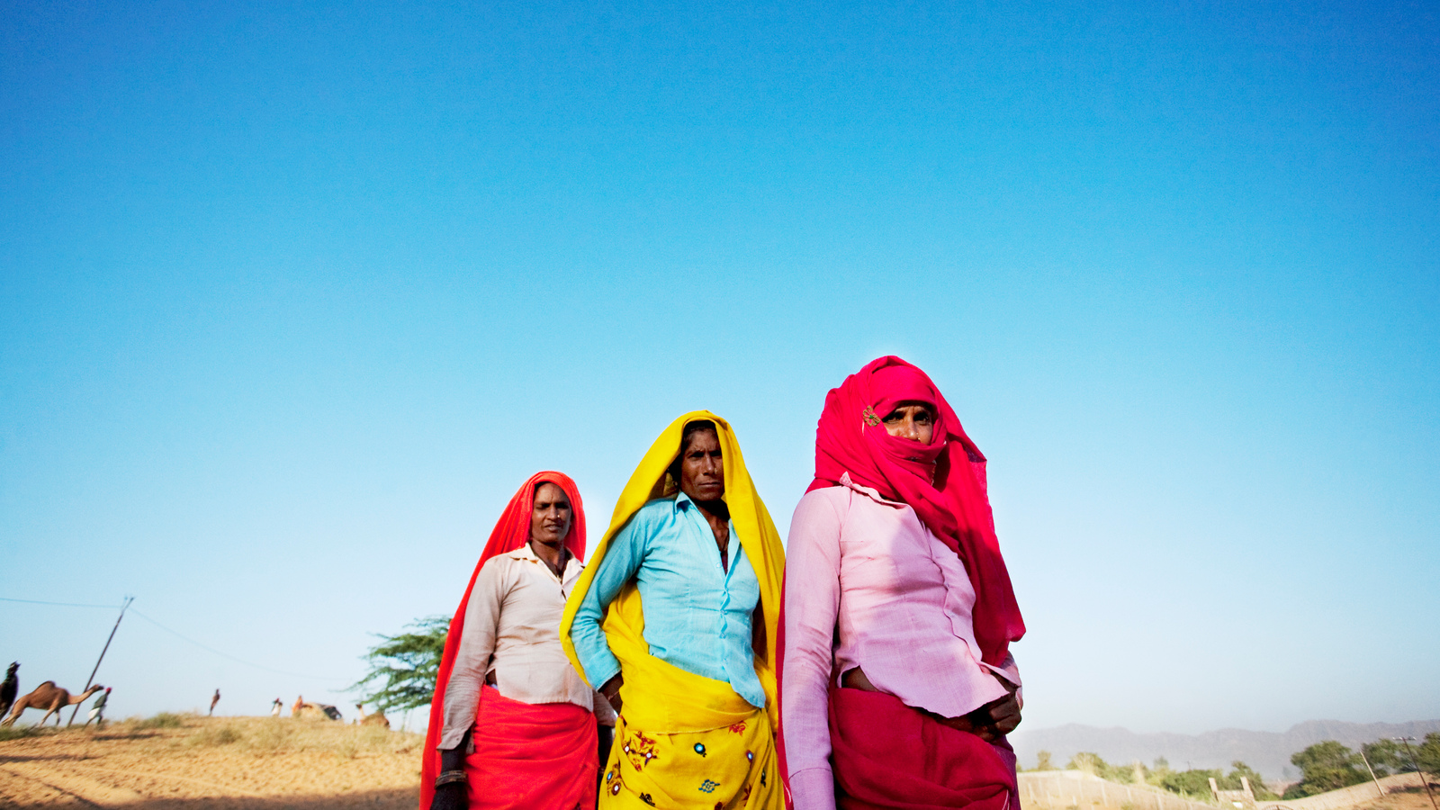 Three Brightly Clothed Women Walking In Line - Vacation - HD Wallpaper 