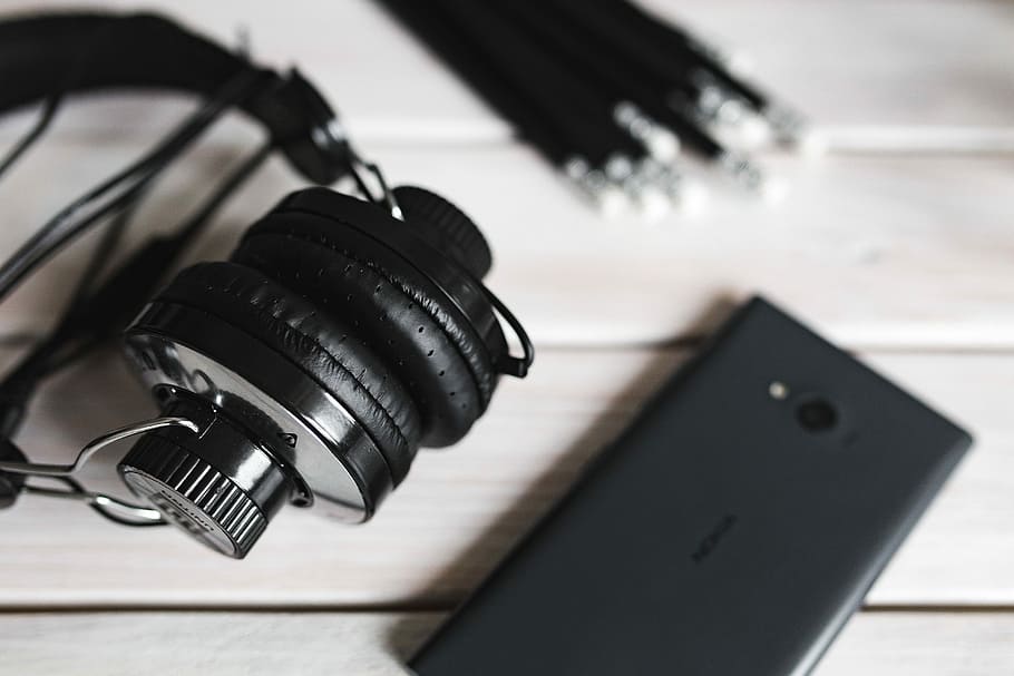 Black Smartphone And Headphones With Various Items, - Photography Music Earphones - HD Wallpaper 