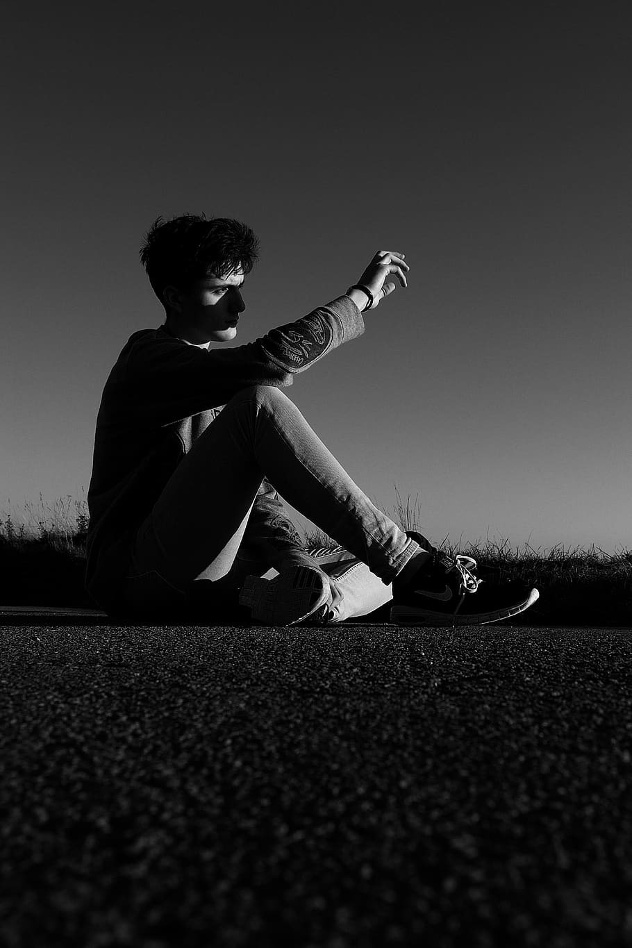 Grayscale Photo Of Man Sitting On Ground Shielding - Monochrome - HD Wallpaper 